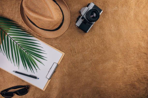 istock Tourist equipment on brown background 1310430125