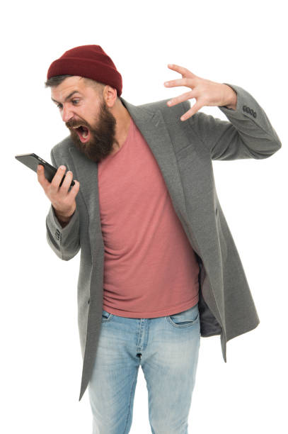 istock Stylish guy use mobile phone. Mobile call concept. Important conversation. Man bearded hipster hold mobile phone white background. Difficulties mobile communication. Hipster smartphone call friend 1310430647