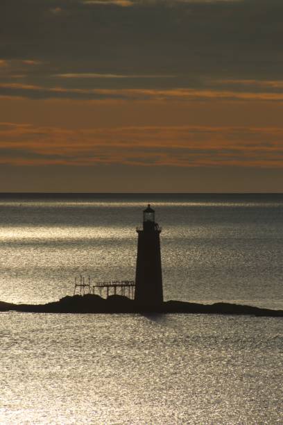 istock Sunrise atlantic ocean light house silouette 1310439998