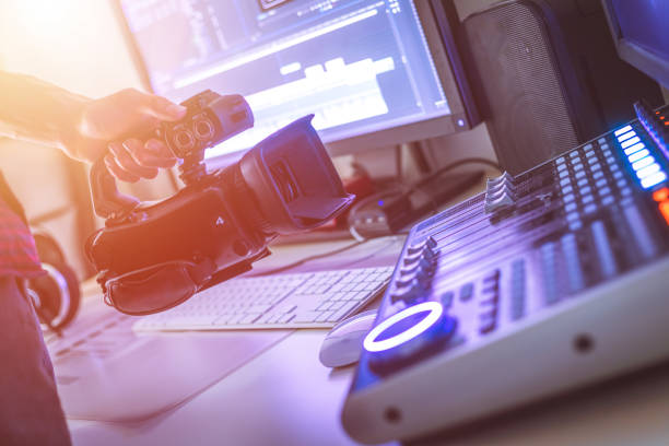 Professional cutting room for video editing and video producing: Monitors, camera and sound mixing