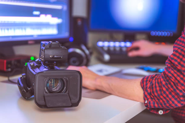 istock Professional cutting room for video editing and video producing: Monitors, camera and sound mixing 1310442977