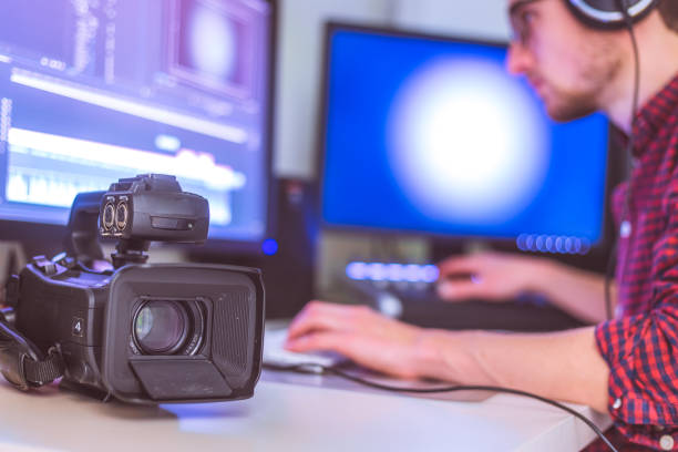 istock Professional cutting room for video editing and video producing: Monitors, camera and sound mixing 1310443656