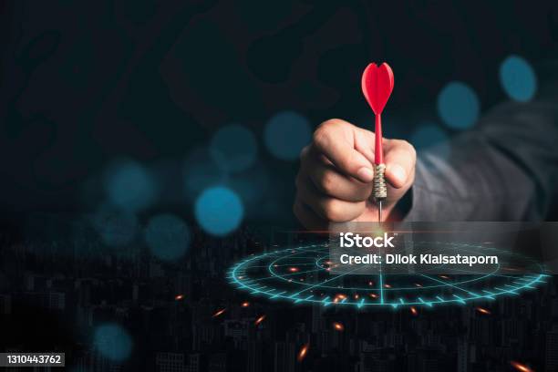 Businessman Throwing Red Arrow Dart To Virtual Target Dart Board Setup Objectives And Target For Business Investment Concept Stock Photo - Download Image Now