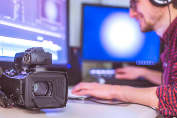 istock Professional cutting room for video editing and video producing: Monitors, camera and sound mixing 1310443794