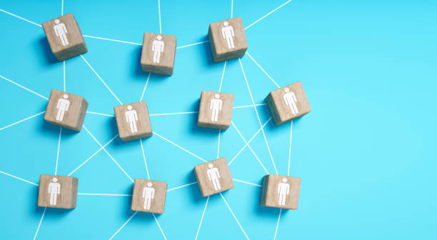 istock Wooden cubes with people icons connected 1310446531