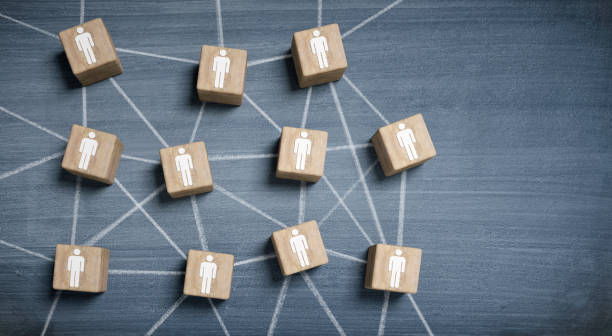 istock Wooden cubes with people icons connected 1310446699