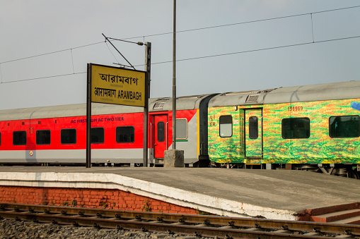 Agra, India - Jul 13, 2015. Indian Railways train stopping at station in Agra, India. Indian Railways carried 8.4 billion passengers annually or more than 23 million passengers daily.