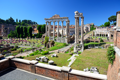 The ruins of the Temple of Saturn in the Roman Forum, Italy. Composite photo