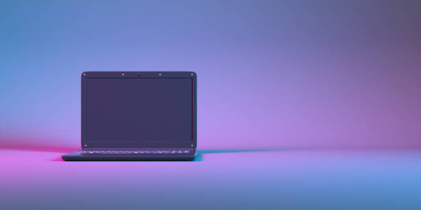 istock laptop in neon light close up 1310448910