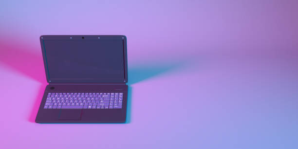 istock laptop in neon light close up 1310448911
