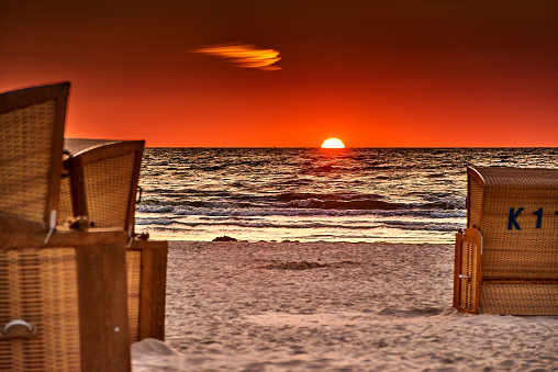 beach chairs on the island of usedom in the sunrise