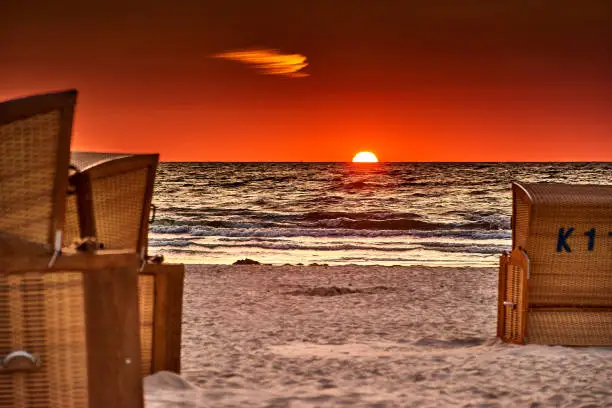 Photo of beach chairs on the island of usedom in the sunrise