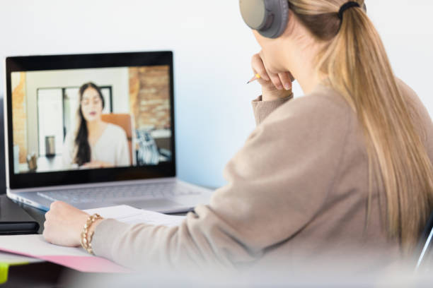 istock College student studies with friend via video conference 1310450631
