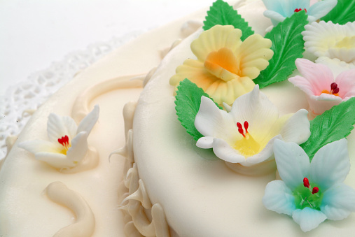 Sugar paste cake, detail of decoration with sugar flowers