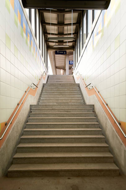 istock stairs in a tunnel to the top 1310453633