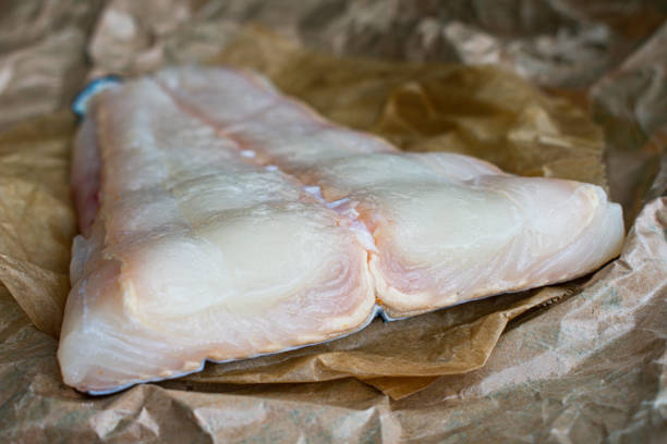 istock Raw Halibut Fillet on Brown Paper 1310453781