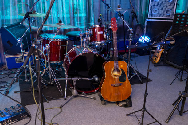 istock Drums and guitar on stage 1310455035