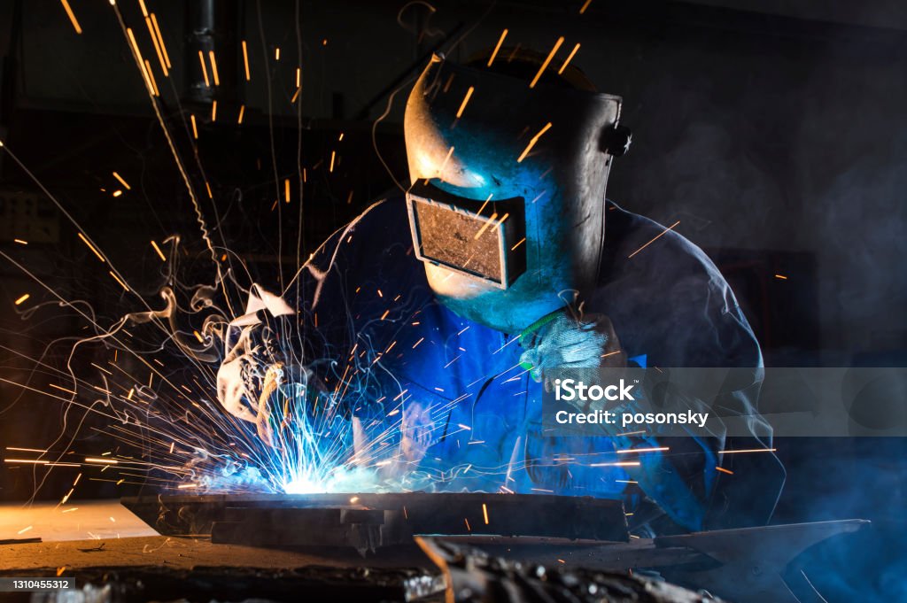welding argon, Results welding on the metal of the foreground Welder Stock Photo
