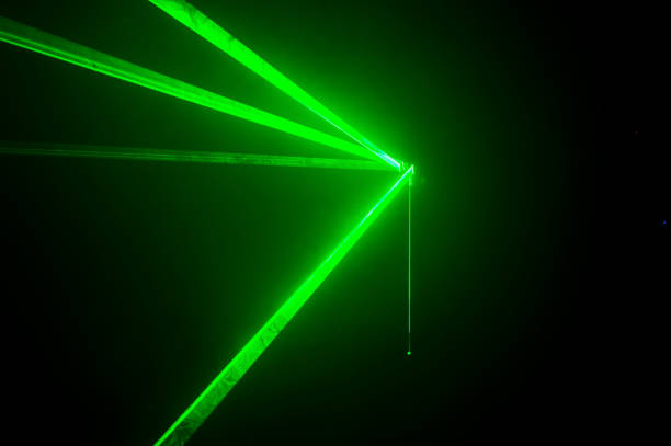 istock Green lasers for show in smoke 1310455326
