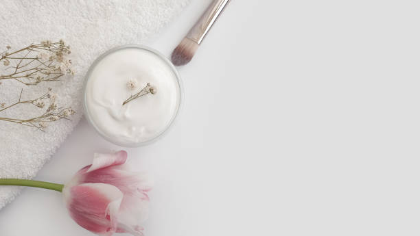 istock cream cosmetic flower tulip on white background 1310455392