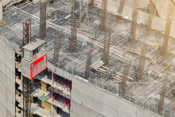 istock Construction workers are working on the concrete floor structure of the condo. 1310456936