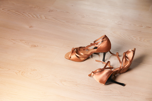 Women's shoes for latin dance and tango on the dance floor. Dance lessons.