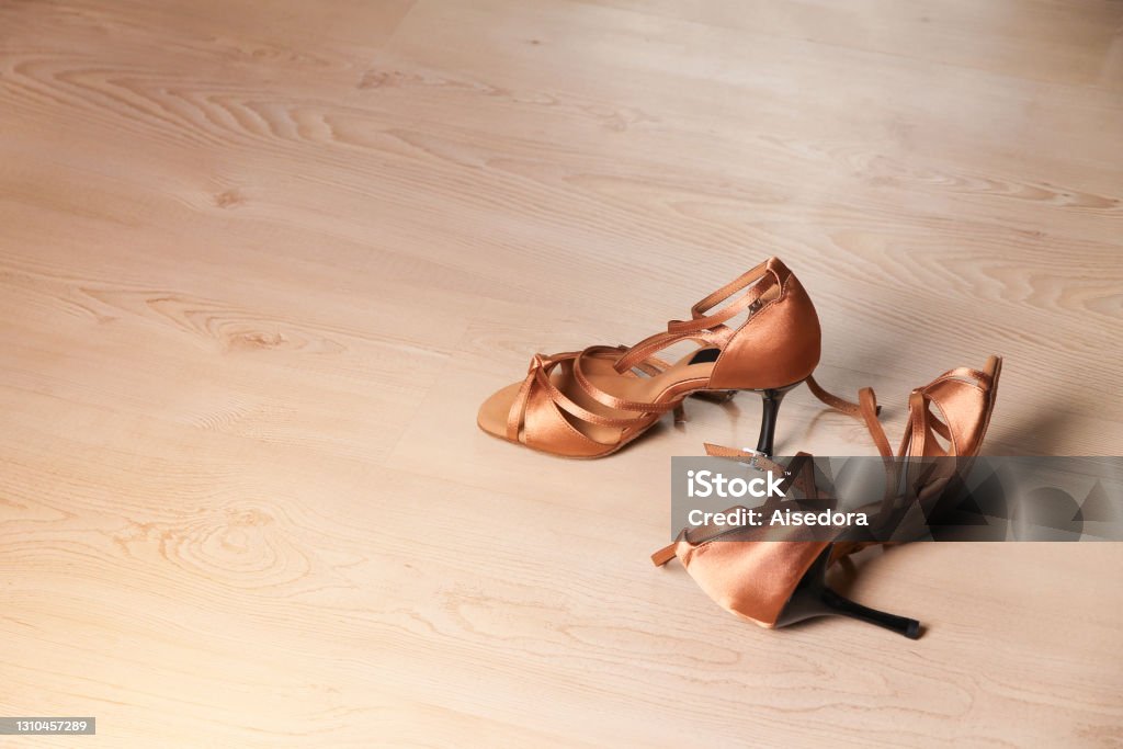 Women's shoes for latin dance and tango on the dance floor. Women's shoes for latin dance and tango on the dance floor. Dance lessons. Dancing Stock Photo