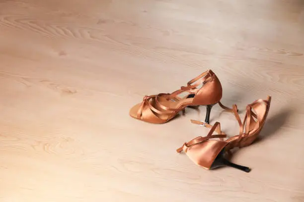 Women's shoes for latin dance and tango on the dance floor. Dance lessons.