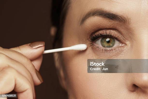 Female Face And Cotton Swab Hygiene Or Makeup Corrections Stock Photo - Download Image Now