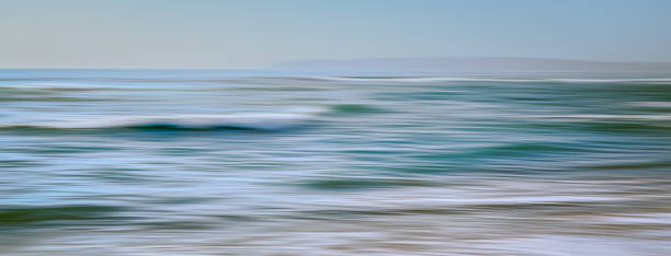 istock Abstract seascape background in light blue, turquoise colors, motion blur, panoramic view 1310458808