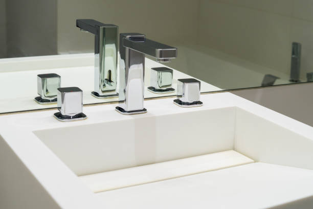 istock Washbasin and faucets in the bathroom mirror 1310461002