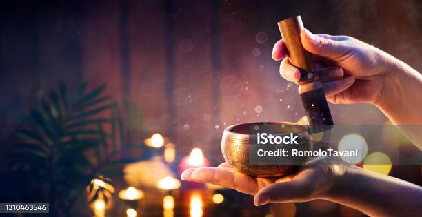 Woman Hands Playing Tibetan Singing Bowl Translation Of Mantras Transform Your Impure Body Speech And Mind Into The Pure Exalted Body Speech And Mind Of A Buddha Stock Photo - Download Image Now