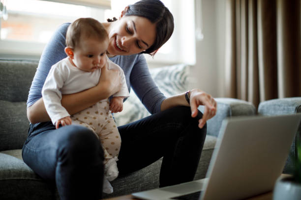 istock Smiling mother and her child having video call from home 1310463812