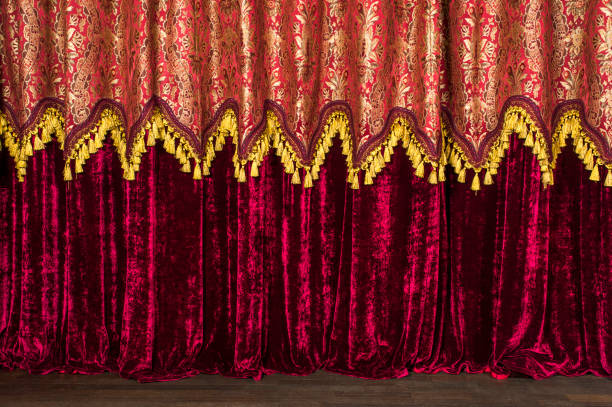 istock dark maroon and yellow patterned curtains decorated with yellow fringe print 1310467356