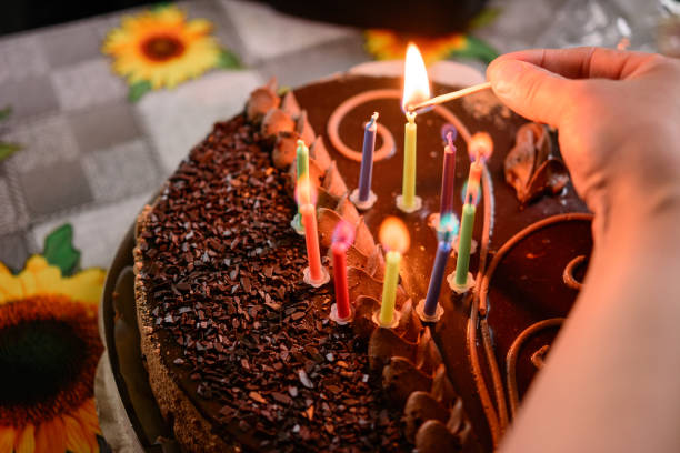 istock Name cake with colored burning candles, holiday and mood. 1310468530