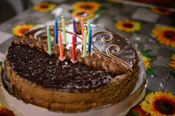 istock Name cake with colored burning candles, holiday and mood. 1310468587