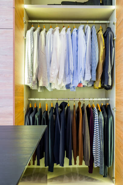 istock Men's wardrobe on hangers in the closet 1310471176