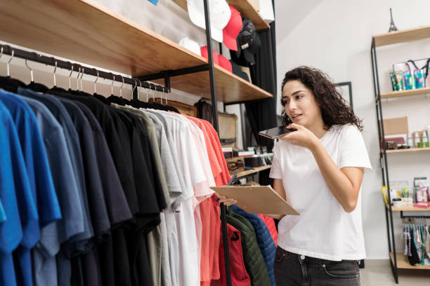 istock Multitasking entrepreneur working at her clothing store 1310472679