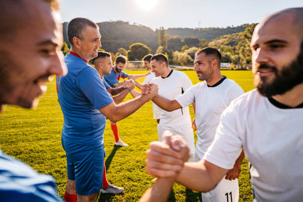 istock Soccer players shaking hands before the match 1310473881