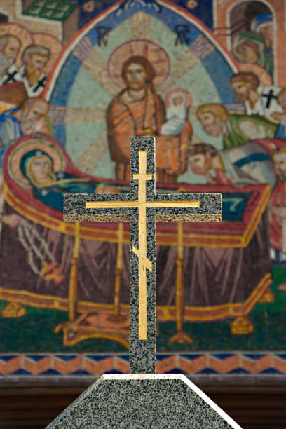 istock Small stone cross on the background of biblical mosaics 1310473961