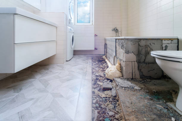 istock Bathroom renovation before and after. Laying new stone tiles in modern math room. Comparison view of floor reconstruction 1310474099