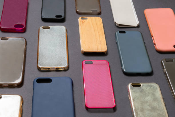 istock Pile of multicolored plastic back covers for mobile phone. Choice of smart phone protector accessories on black background. A lot of silicone phone backs or skins next to each other 1310474832