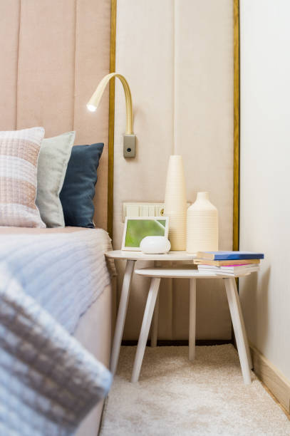 istock Bedside table with books and a vase 1310474890