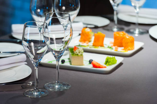 istock Wine glasses on the table in the restaurant, selective focus 1310475000