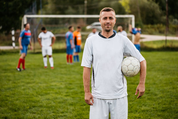 istock Soccer player on football field 1310476778