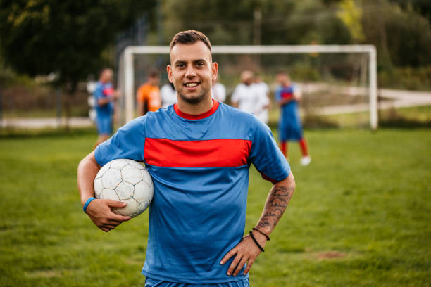 istock Soccer player on football field 1310476853