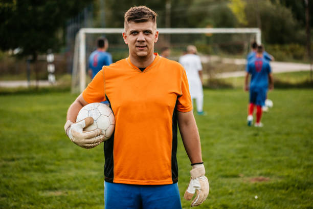 istock Soccer goalkeeper with ball portrait 1310477572
