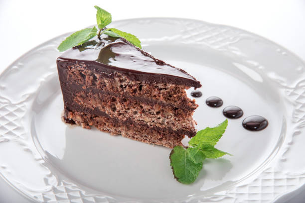 istock piece of chocolate cake with leaves 1310479536