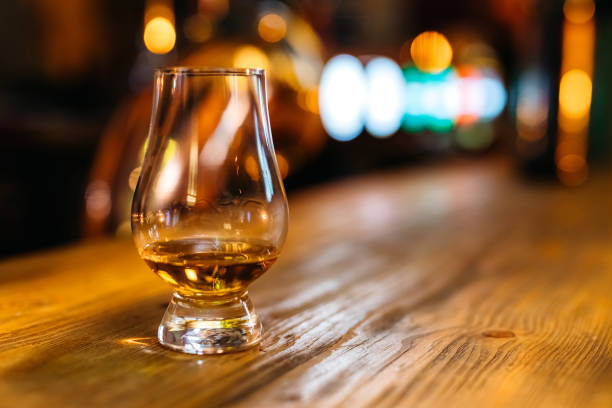 istock Glass of whiskey on bar counter 1310480302