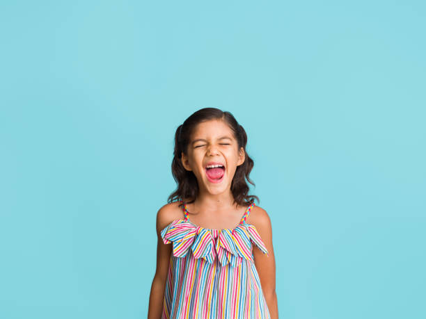 istock Expressive girl shutting her eyes with mouth open 1310480529